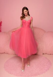 Style #817, tulle A-line dress with a bustier-style bodice and tulle straps; available in midi or floor length; in watermelon (shown online), light green, purple, ivory, pink, black, cherry, grey-blue, azure, powder