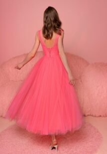 Style #817, tulle A-line dress with a bustier-style bodice and tulle straps; available in midi or floor length; in watermelon (shown online), light green, purple, ivory, pink, black, cherry, grey-blue, azure, powder