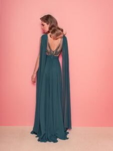 Style #828, chiffon sheath evening gown with cape sleeves and low back; available in grey-blue, green (shown online), purple, light green, watermelon, pink, powder, cherry, azure, black, ivory