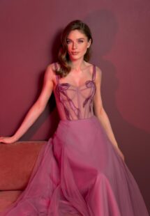 Style #829, tea-length A-line gown with a bustier style bodice and thin straps; available in pink (shown online), light green, ivory, purple, powder, cherry, grey-blue, azure, black, watermelon