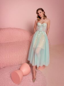 Style #834, tea-length A-line dress with bustier style bodice and spaghetti straps; available in light green