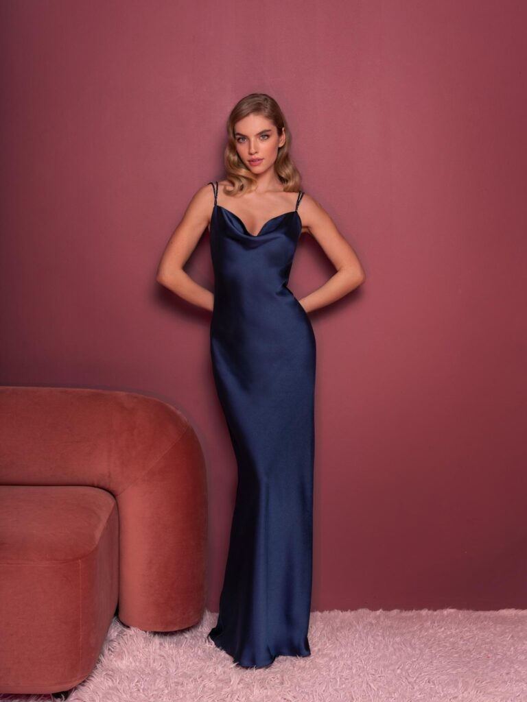 Style #835, slip style evening gown with spaghetti straps and cris-cross open back; available in midi or floor length; in dark blue (shown online), red, burgundy, ivory-peach
