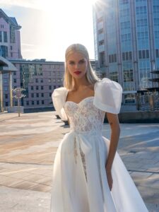 Short lace wedding dress with detachable organza skirt; available in ivory-powder, ivory