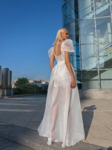 Short lace wedding dress with detachable organza skirt; available in ivory-powder, ivory