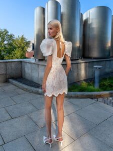 Short lace wedding dress with puffed sleeves; available in ivory-powder, ivory