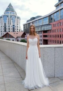 Style #16013, illusion neck A-line wedding gown; available in ivory