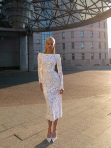 White-powder sheath lace dress with long sleeves and an open back