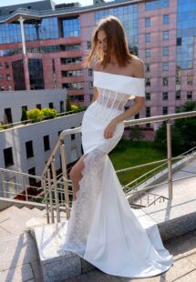 Style #16017, three-piece bridal ensemble with off-the-shoulder cape; available in ivory