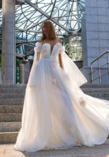 Style #16019, blossom tulle wedding gown with detachable cape sleeves; available in ivory
