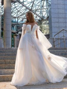 Blossom tulle wedding gown with detachable cape sleeves