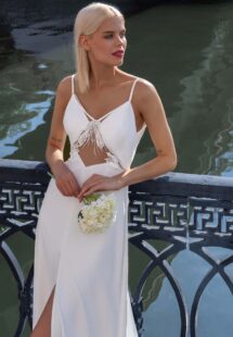 Style #16021, spaghetti strap wedding dress with cut-out detail; available in ivory