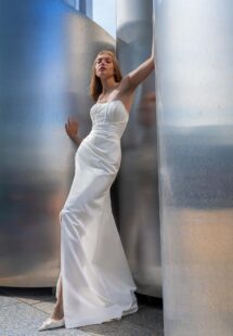 Style #16022, satin wrap-style wedding gown with detachable cape; available in ivory