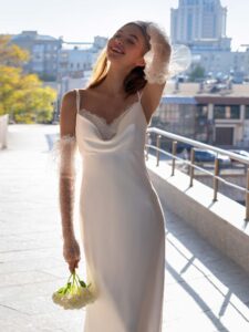 Cowl neckline wedding gown with detachable sleeves