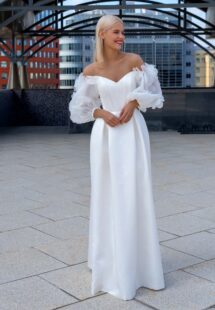 Style #16025c, satin wedding gown with off-shoulder balloon sleeves; available in ivory