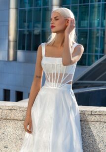 Style #16027, modern midi bridal skirt with structured corset; available in ivory