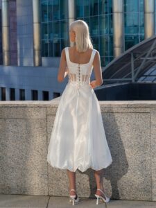 Modern midi bridal skirt with structured corset