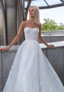 Style #16028, floral ball gown with detachable cape; available in ivory