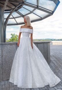 Style #16028, floral ball gown with detachable cape; available in ivory
