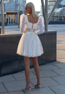 Style #16030a, long sleeve structured corset with a whimsical short skirt; available in ivory