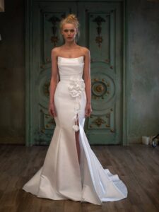 Mikado fit and flare wedding dress with a slit and detachable flower decor