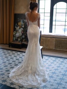 Lace fit and flare wedding dress with long sleeves