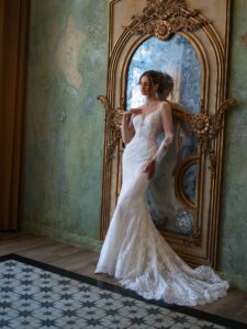 Lace fit and flare wedding dress with long sleeves