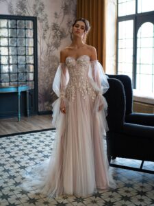 Pink powder wedding dress with sleeves; available in ivory, ivory-powder