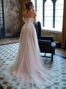 Pink powder wedding dress with sleeves; available in ivory, ivory-powder