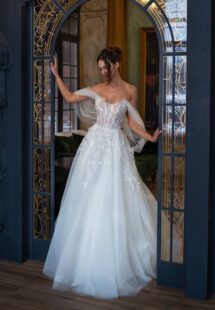 Style #2505L, off-the-shoulder ballgown wedding dress with lace embroidery; available in ivory