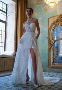 Style #2512L, short wedding dress with a bustier bodice and detachable overskirt; available in ivory