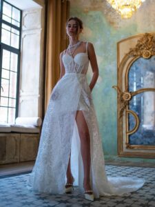 Short wedding dress with a bustier bodice and detachable overskirt