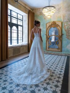 Short wedding dress with a bustier bodice and detachable overskirt