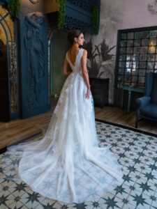Floral ballgown wedding dress with a slit