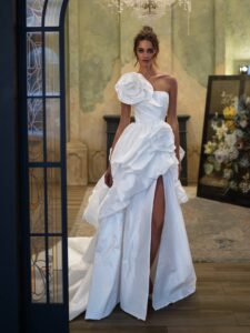 Taffeta ballgown wedding dress with a textured skirt and 3D flowers; available in ivory or white