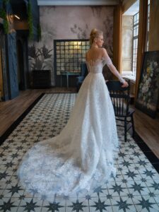 Lace fit and flare wedding dress with off-the-shoulder long sleeves and detachable overskirt