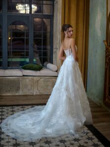 Floral A-line wedding dress with spaghetti straps; available in ivory or pink