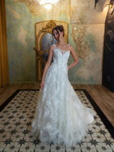 Floral A-line wedding dress with spaghetti straps; available in ivory or pink