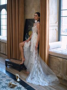 Elegant lace bride dress with a sheer train and intricate detailing, part of Papilio Boutique's exclusive bride dresses collection.