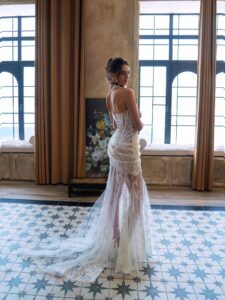 Sophisticated bride dress featuring delicate lace and a modern layered design, available at Papilio Boutique's bride dresses collection.