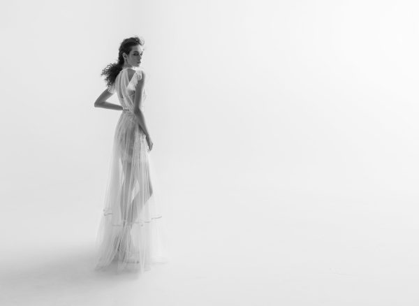 Ethereal sheer wedding dress with delicate lace details and flowing layers, part of Papilio Boutique's wedding dresses Toronto collection.