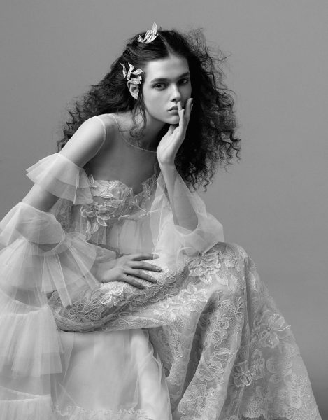 Unique wedding dress featuring tiered lace details, showcasing contemporary elegance for modern brides.
