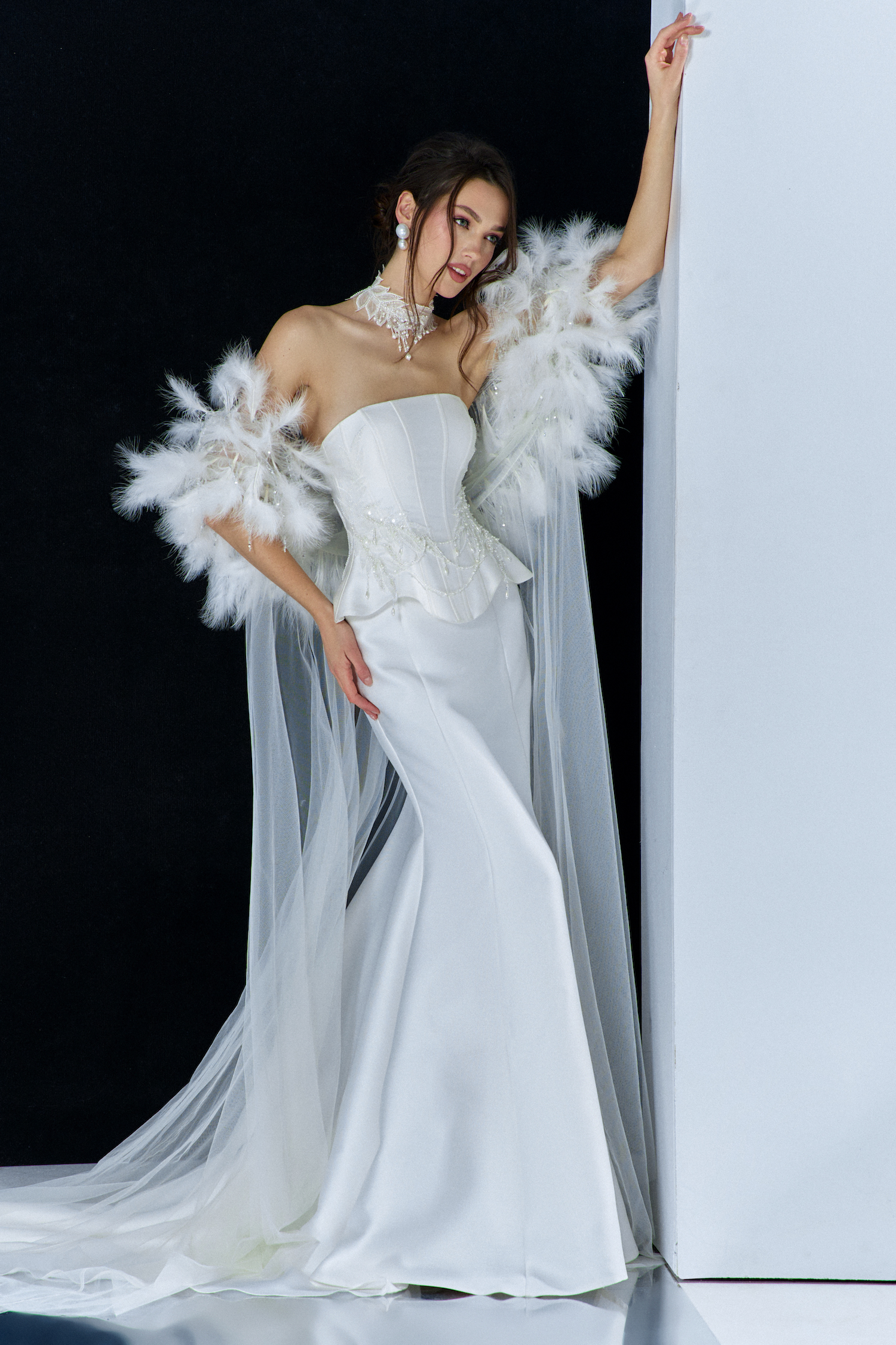 Taylor Swift wedding dress inspiration – elegant strapless satin gown with corset bodice, detachable feathered cape, and pearl accessories from Papilio Boutique Toronto.