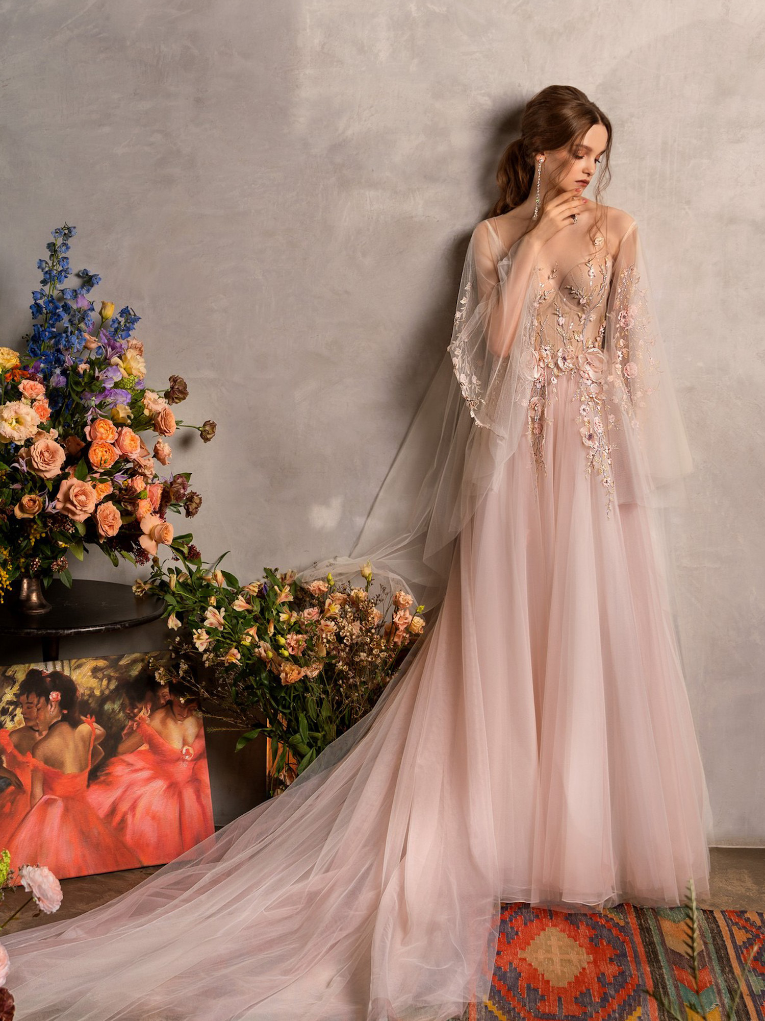 Romantic blush pink non-traditional wedding dress with floral appliqués and long tulle train from Papilio Boutique, part of non-traditional wedding dresses in Toronto