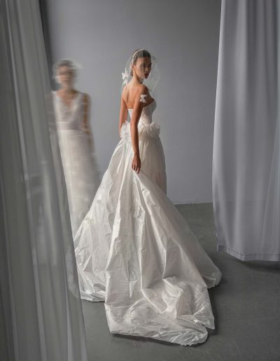 back view of short strapless wedding dress with detachable train, ruching and beaded lace bodice, Toronto bridal shop