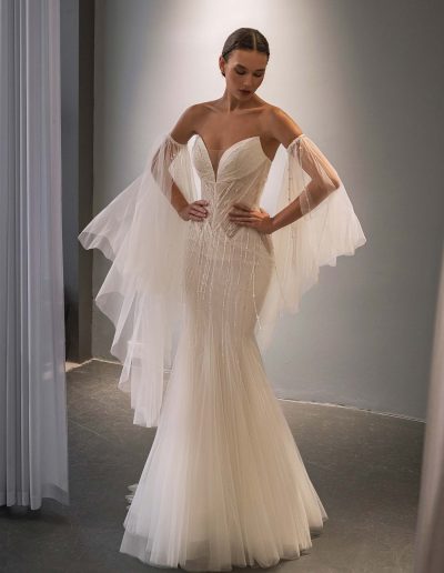 fit and flare wedding dress with cape sleeves, shimmer layer and beading, photographed at Papilio Boutique Toronto, bridal stores in Toronto