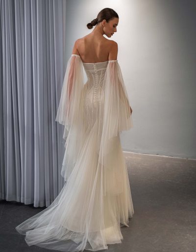 fit and flare wedding dress with cape sleeves, shimmer layer and beading, photographed at Papilio Boutique Toronto, bridal stores in Toronto