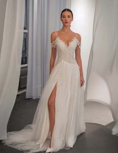 off the shoulder tulle wedding dress with lace bodice and slit by Papilio Boutique bridal store in Toronto