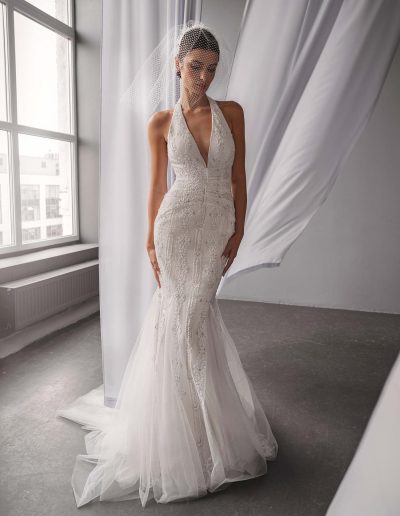 Fully beaded halter neck mermaid wedding dress with vintage lace by Papilio, couture beaded bodice and tulle mermaid skirt — Toronto bridal shop.