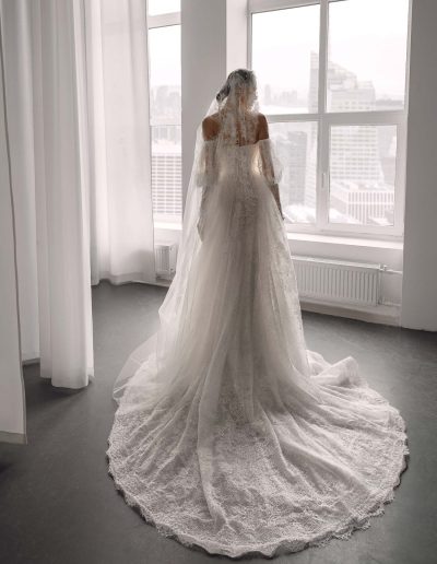 Shimmering lace ballgown wedding dress with detachable sleeves by Papilio, back view with long lace train and glitter layer — Papilio Boutique Toronto.