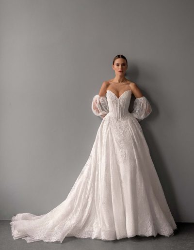 Shimmering lace ballgown wedding dress with detachable sleeves by Papilio, lace train and basque waist — photographed for Papilio Boutique bridal shop Toronto.